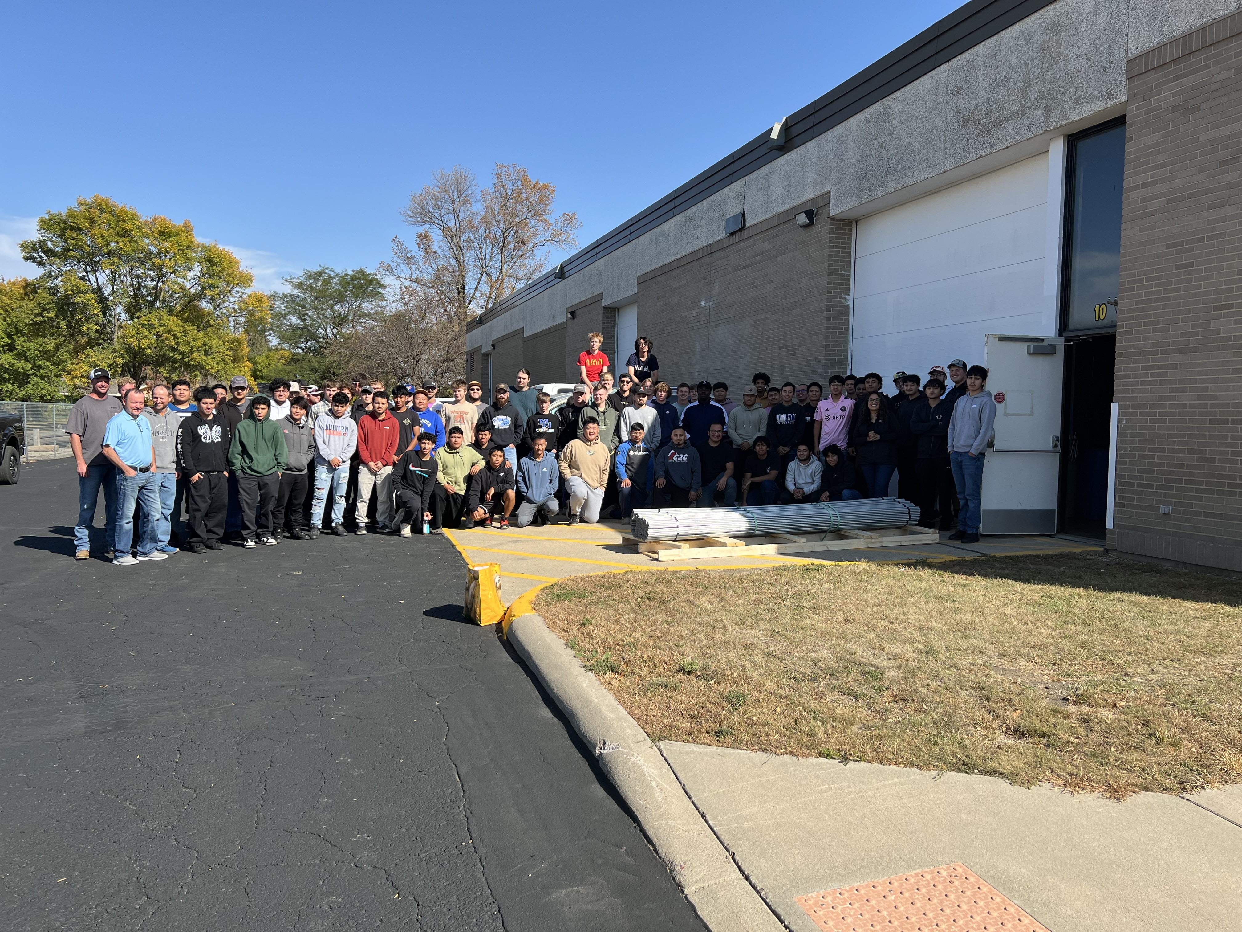 group of students from Minnesota West with conduit in front of them