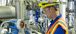 An on-site service technician working on equipment.