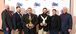 Six men wearing suits accepting two ABC Eagle Awards.