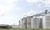 Outside view of grain bins at a grain facility.
