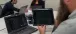 a laptop screen with alarm information from a PID loop and a tablet screen with daily PID loop trends.