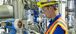 Man working on an electrical instrument.
