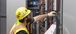 Man working on electrical wires.