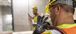two people pulling wire on a construction job site