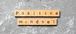 scrabble pieces on a gray background that spell out positive mindset