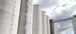 Upward view of the exterior of a flour milling facility.