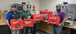 Men holding Milwaukee tool kits