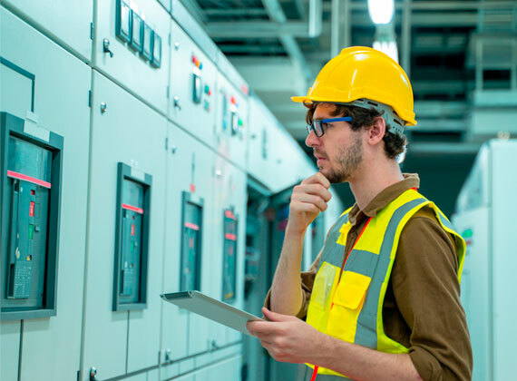 Electrician reviewing a system to determine if there are code violations.