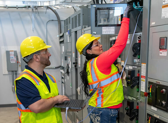 Two people working in industrial cybersecurity.