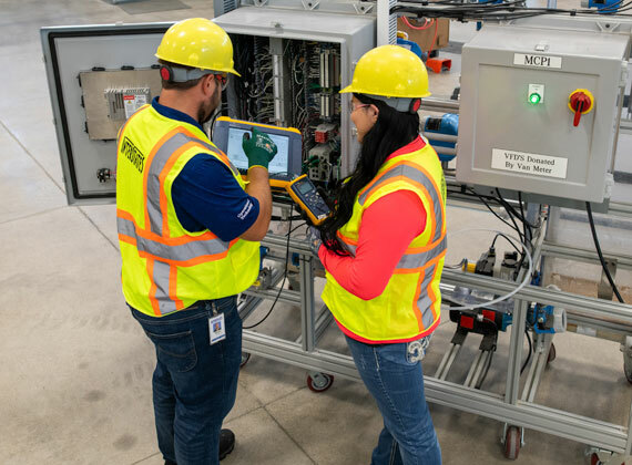 Two individuals working in industrial cybersecurity.