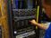 Technical expert reviews the hardware on a server.