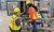 Two workers in PPE observing a panel together with one pointing.