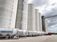 A row of large grain bins.