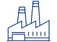 A blue outlined icon of an industrial factory. The image features a building with three angular rooftops, two tall chimneys or smokestacks in the background, and a large entrance or loading bay in the front. The icon represents manufacturing or industrial production.