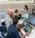 High View of Employees Collaborating at Monitors