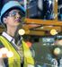 woman in PPE looking up with an image overlay of data