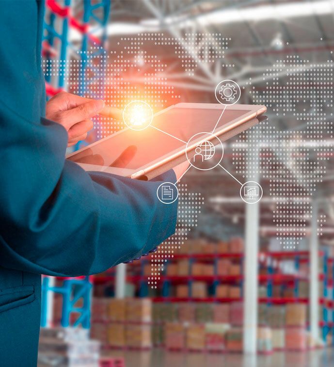 Close-up view of an individual using a tablet on the plant floor.