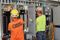 Two Interstates team members working on electrical panels.