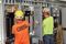 Two Interstates team members working on electrical panels.